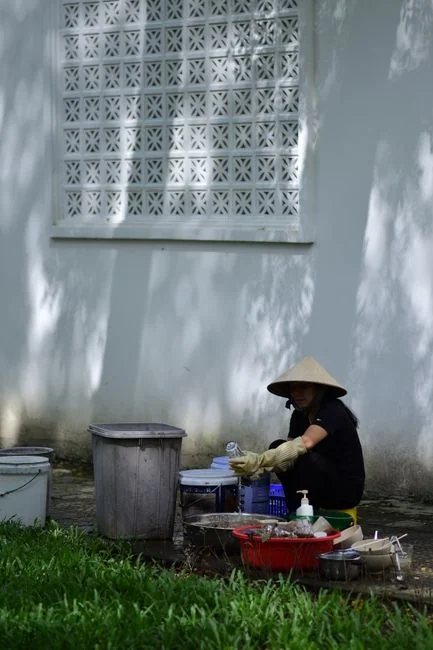 A professional is cleaning a sofa with a grinder indoors, demonstrating efficient service.